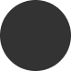 Circular dark gray icon with a smaller circular cutout in the center, resembling a stylized compliance or security symbol.